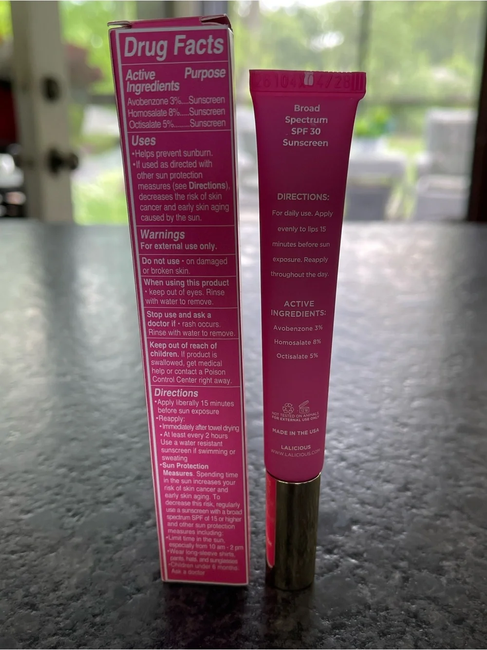 LALICIOUS Hydrating Butter Gloss SPF 30 in Berry Bomb shine shield plump hydrate